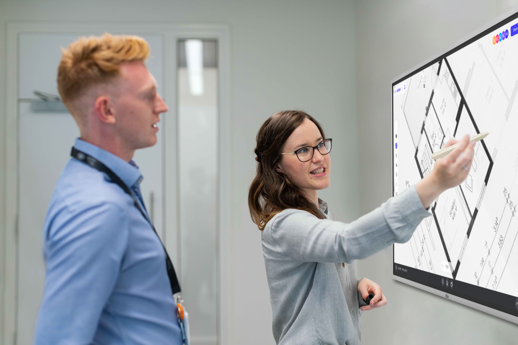Engineers using a Vibe touchscreen digital whiteboard.