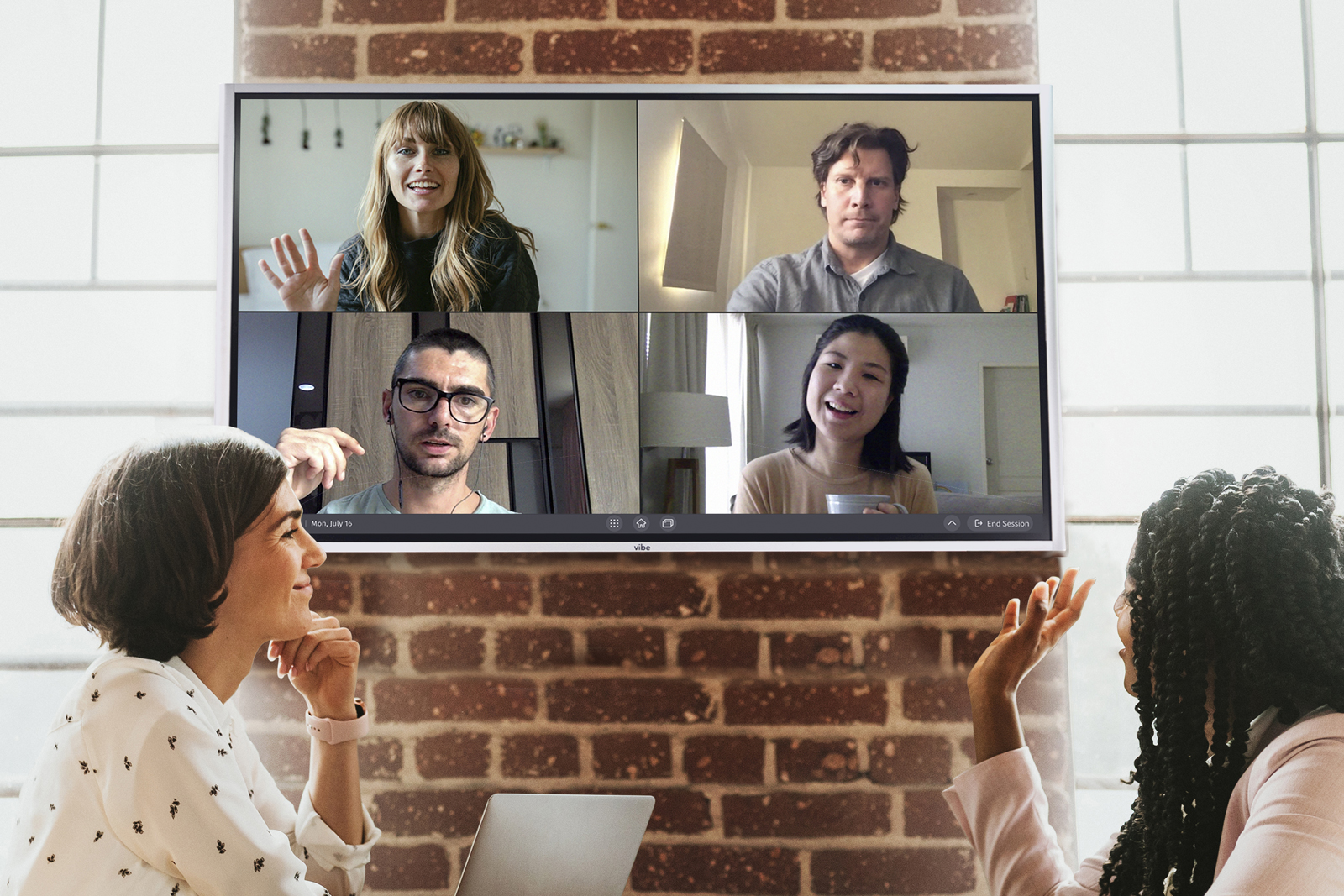 Collaborating in front of a touchscreen.